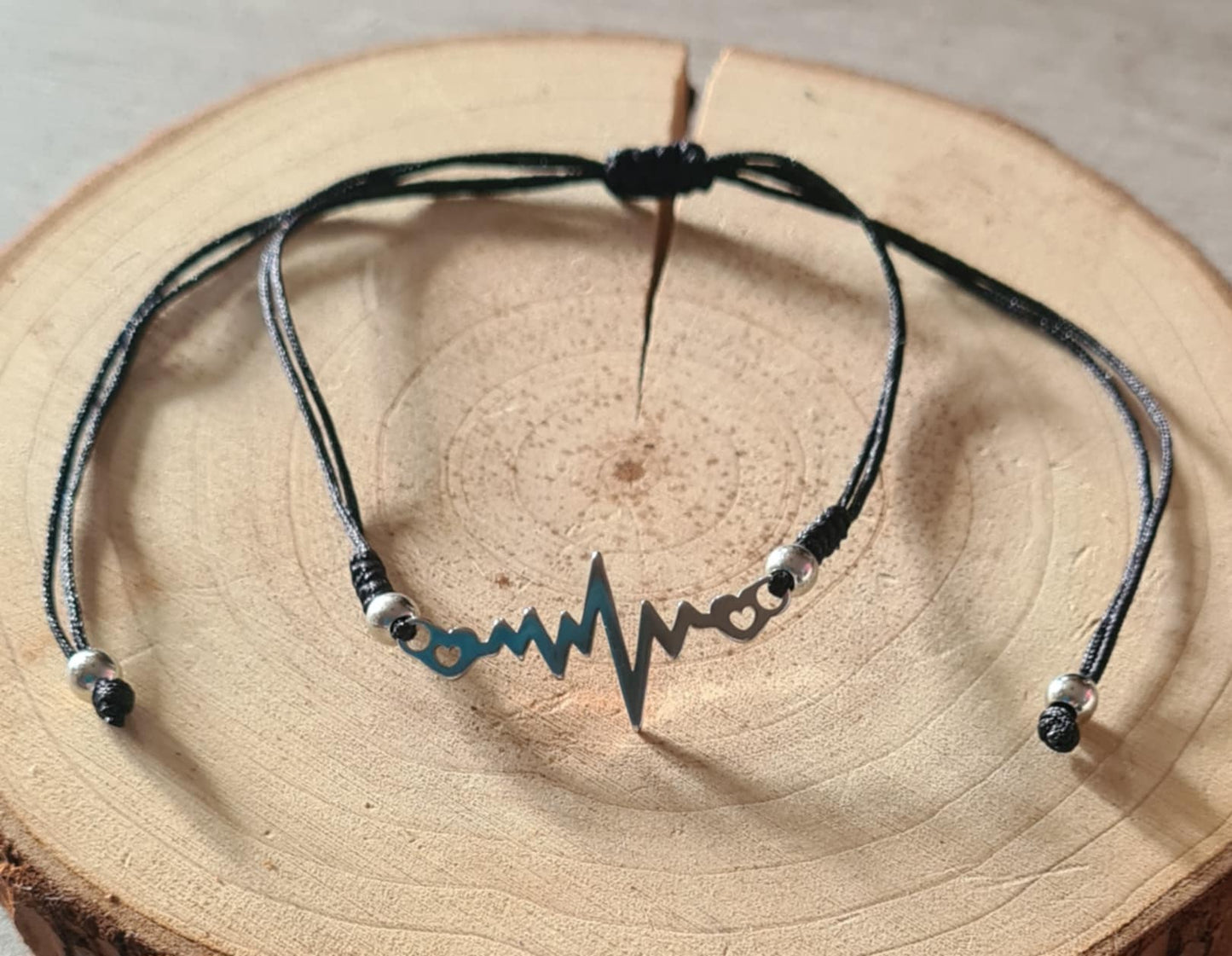 Bracelet symbole en acier inoxydable